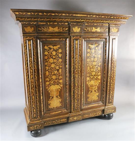 A 19th century Dutch walnut and marquetry armoire, W.6ft 3in. D.2ft 5in. H.6ft 4in.